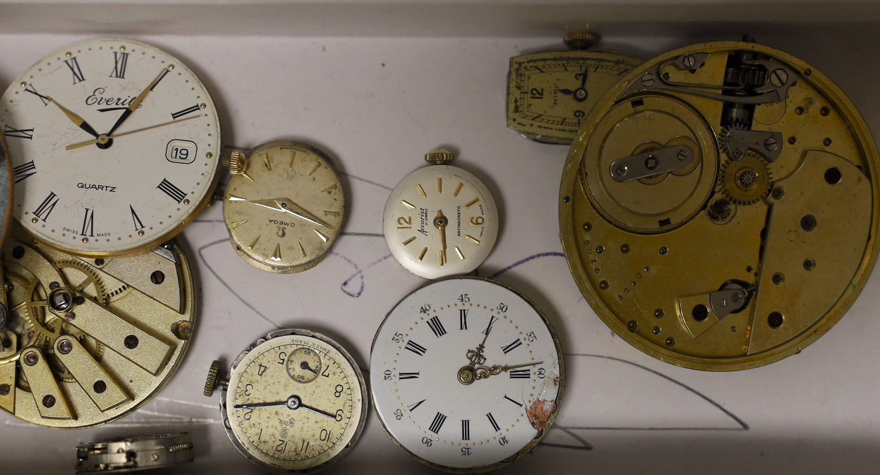 A gold plated Waltham hunter pocket watch, one other gold plated pocket watch and a small group of wrist and pocket watch movements.